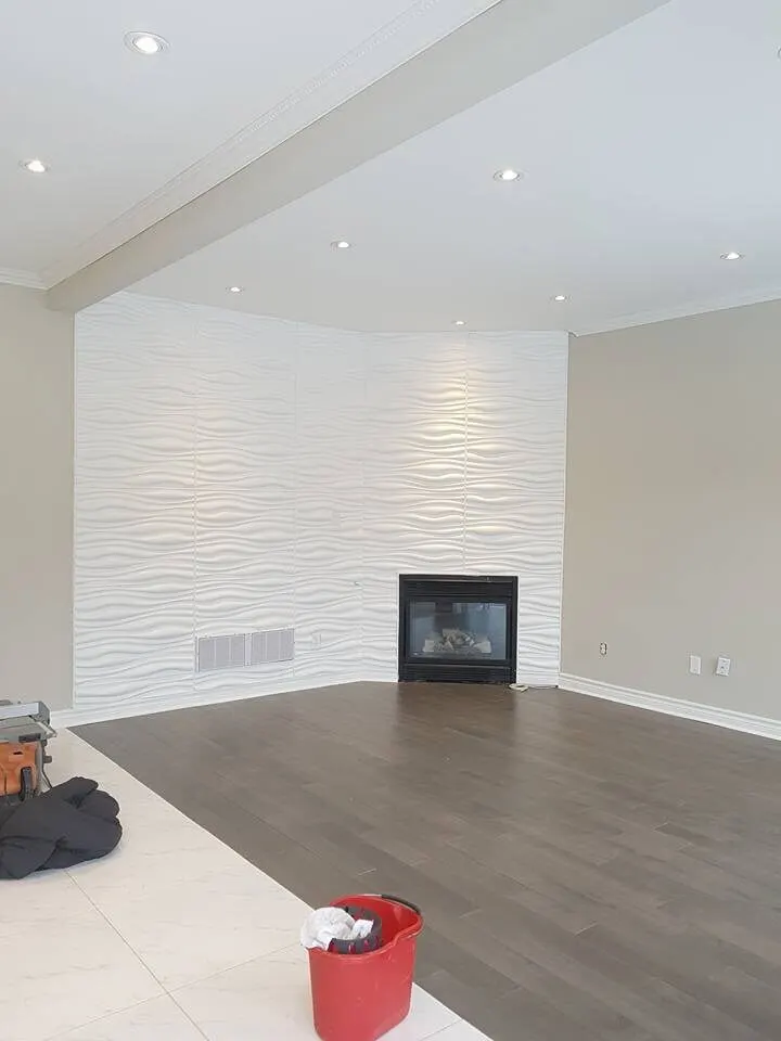 White textured feature wall around a fireplace